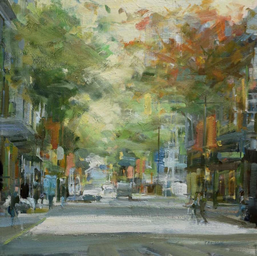 Weekday alongside the square Vancouver oil painter, Leanne M Christie of a Street in downtown Vancouver. The painting has orange autumn trees with people crossing the street.