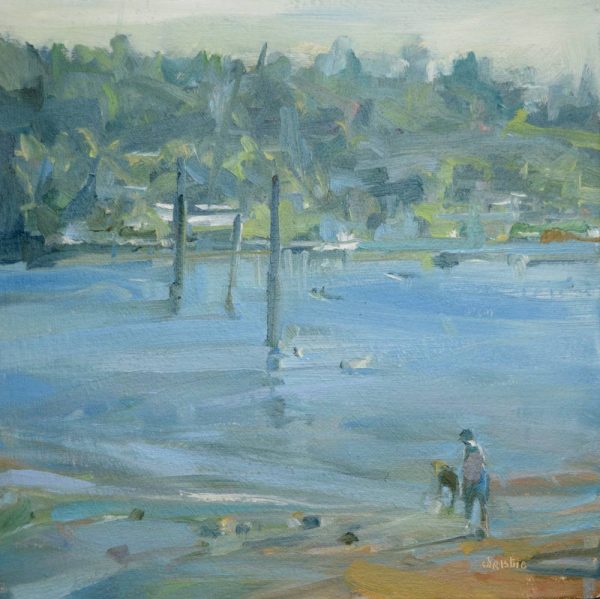 Leanne M Christie oil painting of the Burrard Inlet with Rocky Point Park in the distance. The viewer is standing on Old Orchard beach looking south across the water. In the foreground Leanne Christie suggests a person and a dog. The blue of the water is a soft cerruleun, the far shore is dominated by green trees and the sky is a tinted, hazy yellowish white. The orange brown of the beach in the foreground gives the loosely described painting a lively feel.