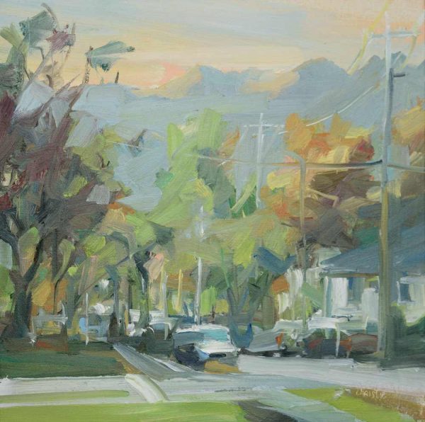 Canadian Oil painter, Leanne M Christie painting of an East Vancouver street at the start of Autumn. The street is lined with trees that have a mixture of yellow, orange and green and the sky has the soft oranges of an Autumn sunset on the Canadian West Coast. Leanne Christie has placed the viewer on the sidewalk looking across the street. Genre: Landscape, streetscape.