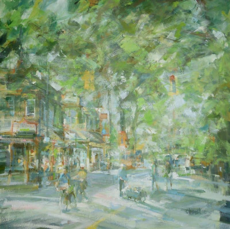 Artist: Leanne M Christie Medium: Oil on canvas Genre: Urban Oil painting Style: Contemporary Impressionism Location: Fort Langley, intersection of Glover Road and Trans Canada Trail with Wendels Bookstore. Colours: Green, soft blue and orange The street is framed by the trees in full bloom with the sunlight softly hitting the street. Pedestrians and cyclist meander across the road.